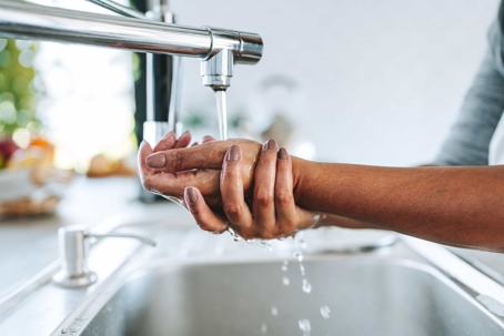 hand washing in a kitchen sink