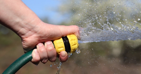 spraying outdoor water hose