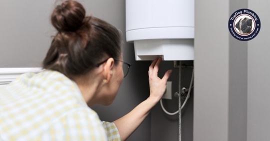 woman touching a water heater